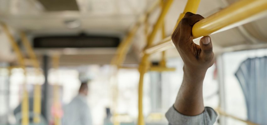 close-up-hand-holding-bus-bar